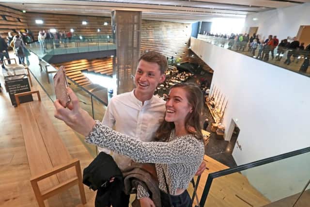 Rebbeca Young, 23, from Denny and Ewan Baird, 26, from Falkirk take a selfie inside the new V&A Dundee. Picture: Andrew Milligan/PA Wire