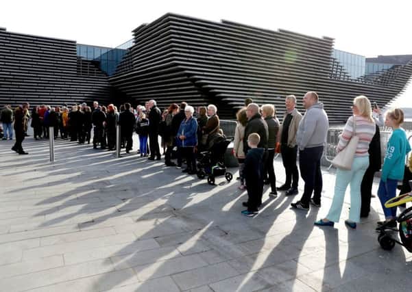 People queue outside the new V&A Dundee, as the Â£80.1 million museum officially opens to the public. Picture: Andrew Milligan/PA Wire
