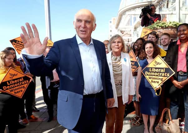 Sir Vince Cable and his wife Rachel Smith arrive at their hotel in Brighton ahead of the Lib Dem party conference. Photograph: PA