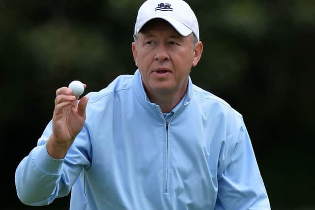 Gary Orr reacts as he sinks a birdie putt at the 18th hole on day two of the Scottish Senior Open at Craigielaw. Picture: Mark Runnacles/Getty Images