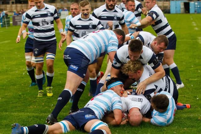 Jason Hill scores the first try of the game for Heriots. Pic: Scott Louden