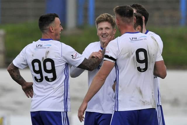 Peterhead's Willie Gibson celebrates his goal with Rory McAllister and Derek Lyle, who also got on the scoresheet (picture by Duncan Brown).