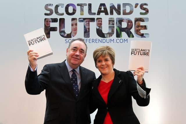 Alex Salmond and now First Minister Nicola Sturgeon hold copies of the White Paper on independence.