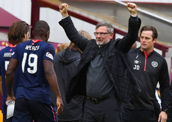 Hearts manager Craig Levein celebrates his team's win at the end of the match. Picture: SNS