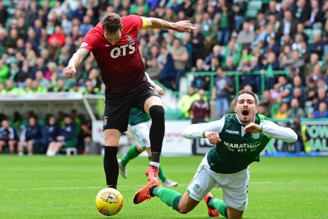 Hibernian's Jamie Maclaren is fouled by Kilmarnock's Kirk Broadfoot and a penalty is given. Picture: SNS