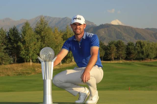 Liam Johnston poses with the tropht after his two-shot win in the Kazakhstan Openin Almaty