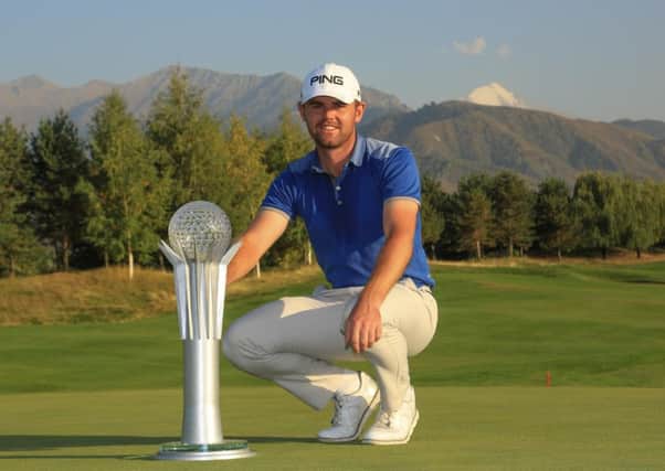 Liam Johnston poses with the tropht after his two-shot win in the Kazakhstan Openin Almaty