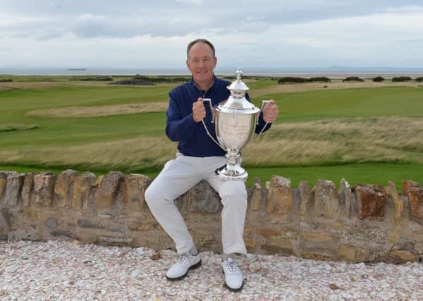 Gary Orr poses with the trophy after his one-shot victory in the Scottish Senior Open at Craigielaw. Picture: Mark Runnacles/Getty Images