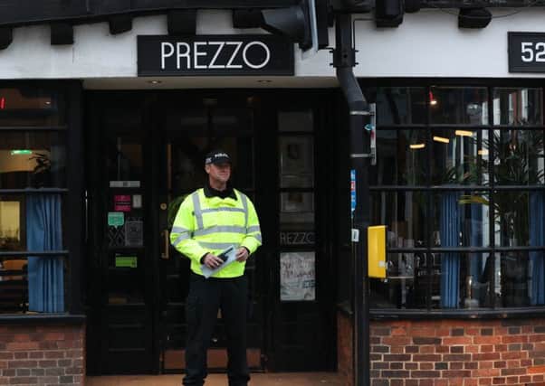 A Policeman outside the restaurant. Picture: PA Wire