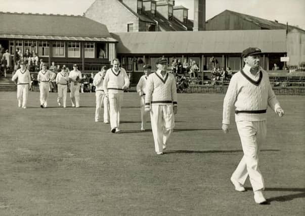 Don Bradman leads the Australian team out at Mannofield, Aberdeen. Picture: Herald & Times Archive