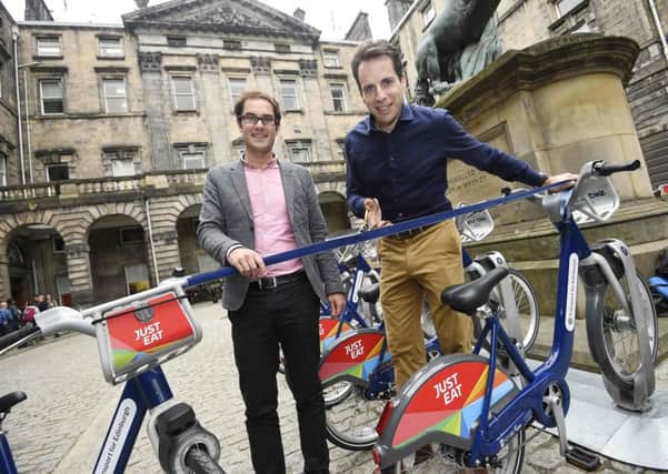 Cyclist Mark Beaumont and Cllr Adam McVey launch the new bike scheme. Picture: Greg MacVean