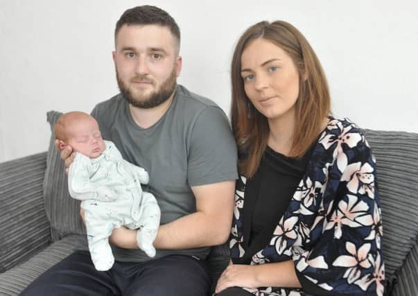 Graeme Abbott with sister Nicola Abbott and baby Archer. Picture: SWNS