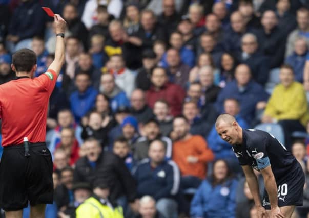 Kenny Miller is sent off by Kevin Clancy for his challenge on Borna Barisic. Picture: SNS Group