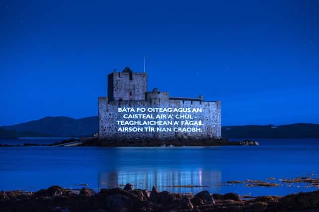 Kisimil Castle off the coast of Barra is illuminated with the poem in tribute to its Gaelic heritage.  PIC: HES.