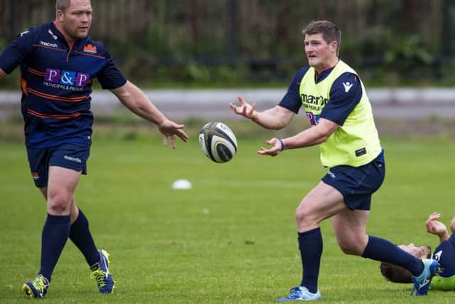 Edinburgh's James Johnstone passes to WP Nel in training. Picture: Gary Hutchison/SNS/SRU