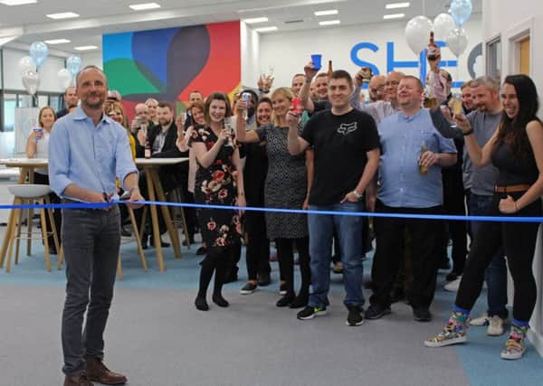 Chief executive Matthew Elson and the SHE Software team celebrate the opening of the new East Kilbride office. Picture: Contributed