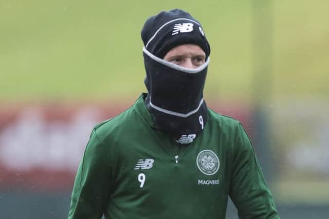 Celtic's Leigh Griffiths wraps up against Storm Ali. Picture: Paul Devlin/SNS