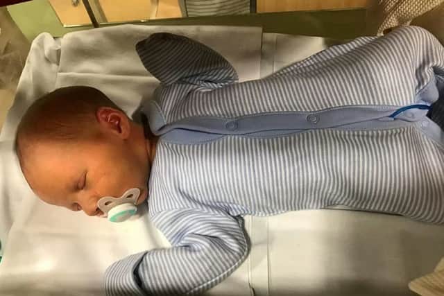A cancer survivor has welcomed his "miracle baby" after his partner found out she was unexpectedly pregnant -. Picture: SWNS