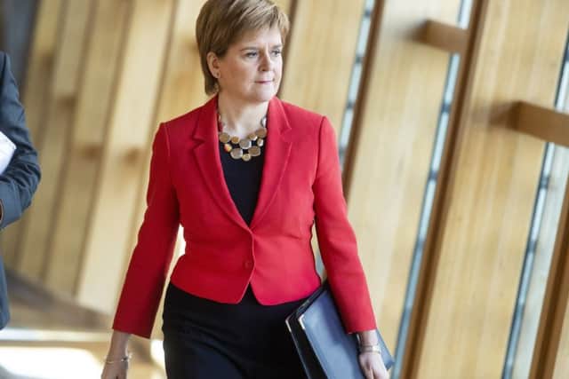 First Minister Nicola Sturgeon walks to FMQs. Picture: SWNS