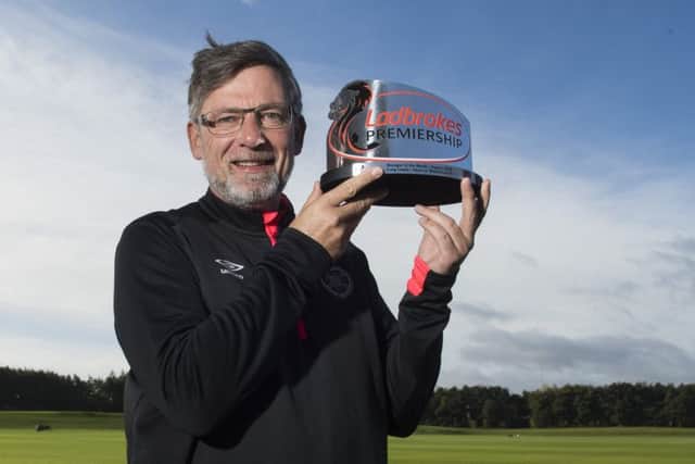 Craig Levein with the Ladbrokes Premiership Manager of the Month award for August. Picture: Paul Devlin/SNS