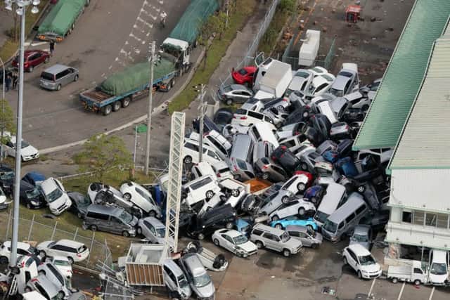 Vehicles piled in a heap after after typhoon Jebi, which resulted in nine deaths, hit the west coast of Japan earlier this month. Picture: Jiji Press/AFP/Getty