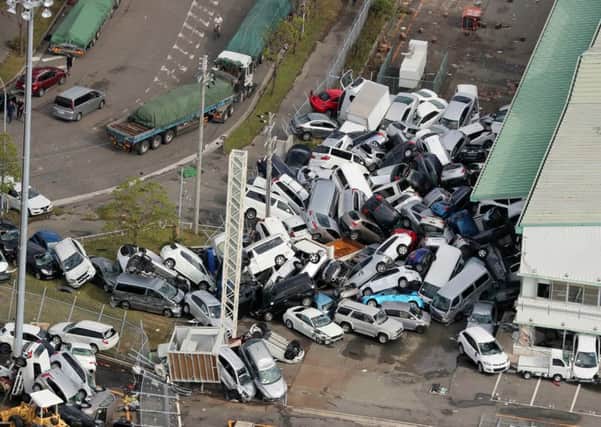 Vehicles piled in a heap after after typhoon Jebi, which resulted in nine deaths, hit the west coast of Japan earlier this month. Picture: Jiji Press/AFP/Getty