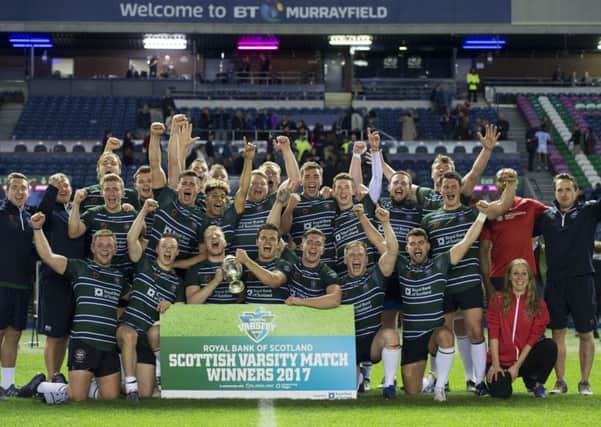 The University of Edinburgh players celebrate their victory over their St Andrews counterparts in last year's Scottish Varsity match. Picture: SNS/SRU