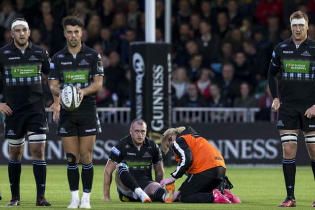 Glasgow Warriors' Stuart Hogg is treated on the pitch during the 25-10 win over Munster. Picture: SNS Group