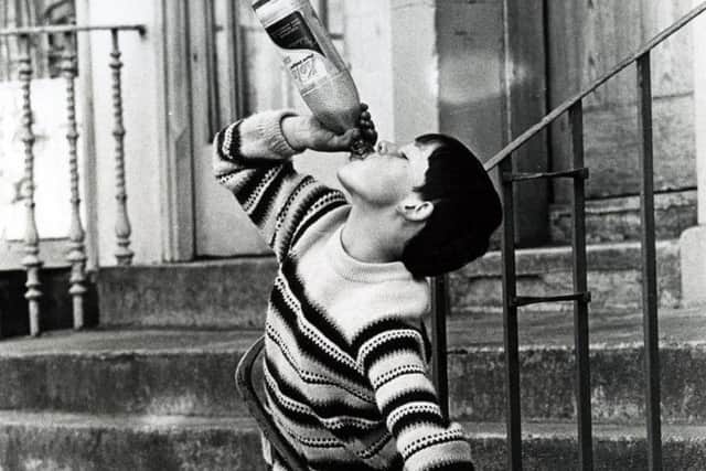 A boy drinking cola in Stockbridge. Picture: Robert Blomfield