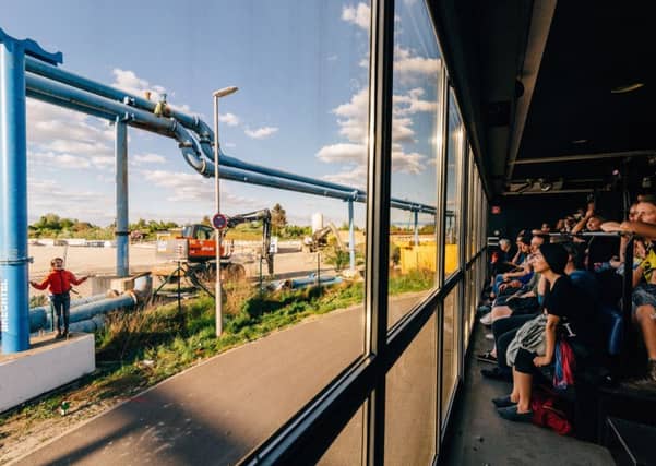 The audience peers through the one-way mirror. Picture: Andre Wunstorf