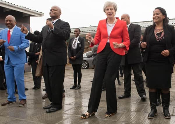 Prime Minister Theresa May indulges in a spot of dancing on her recent visit to Africa  but David Robertson says there was a more sinister aspect to her trip with funding for birth control programmes. Picture: Stefan Rousseau/PA Wire