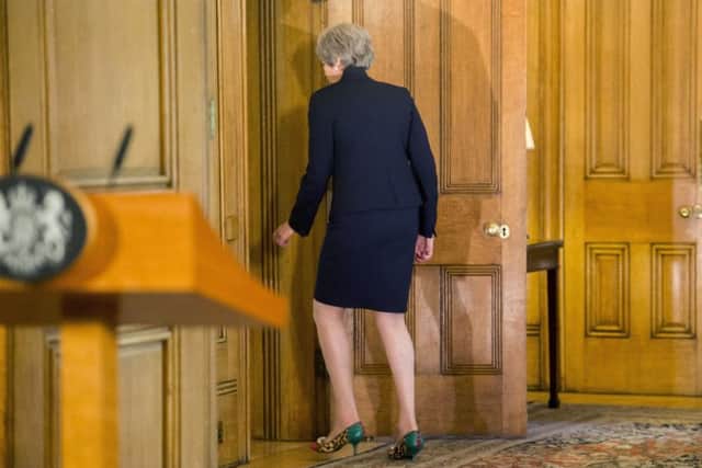 Theresa May leaves after making a statement on Brexit negotiations with the European Union. Picture: AP