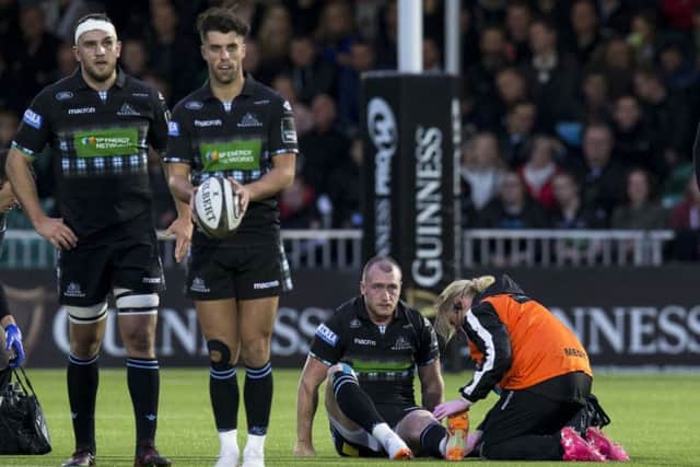 Stuart Hogg is treated on the pitch during Glasgow's win over Munster. Picture: SNS
