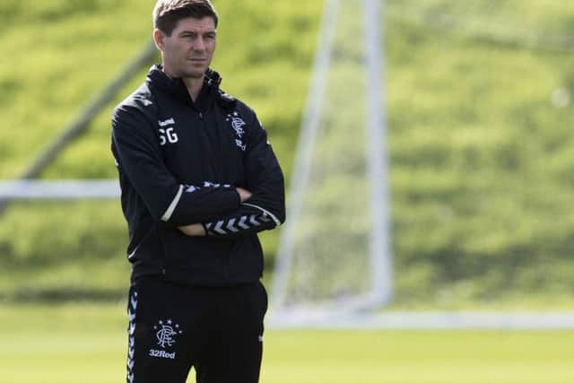 Back on the training ground the day after Rangers 2-2 draw in Villarreal, Steven Gerrard is very happy with life in Glasgow. Picture: SNS.