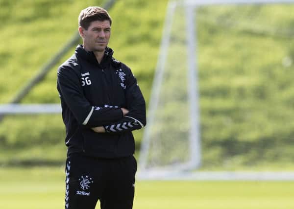 Back on the training ground the day after Rangers 2-2 draw in Villarreal, Steven Gerrard is very happy with life in Glasgow. Picture: SNS.