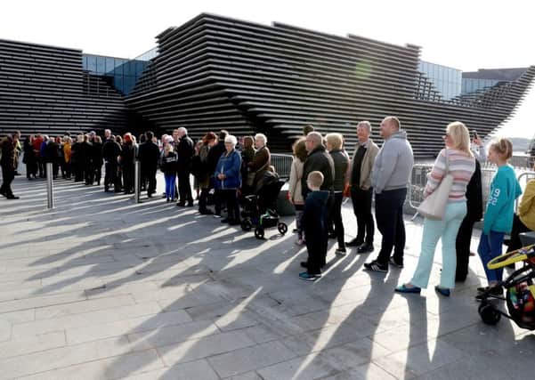 Visitors inside and outside Kuma's stunning new building last week. Photograph: PA Wire