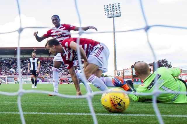 Fredrik Brustad wheels away after netting the opening goal for Hamilton. Picture: SNS Group