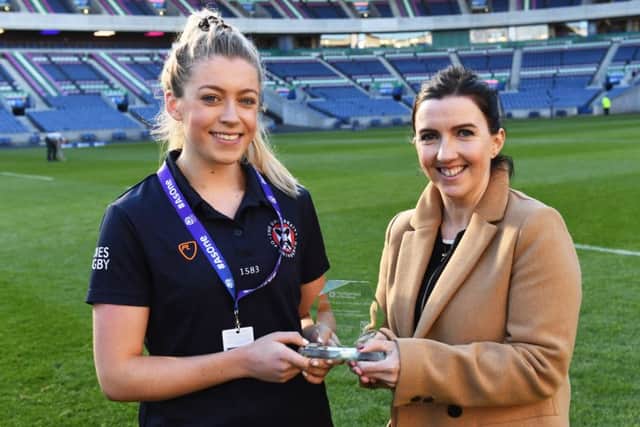 Player of the match Lucy Winter is presented with her award by Fiona Chadwick. Picture: SNS Group