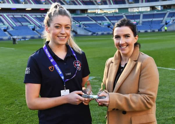 Player of the match Lucy Winter is presented with her award by Fiona Chadwick. Picture: SNS Group