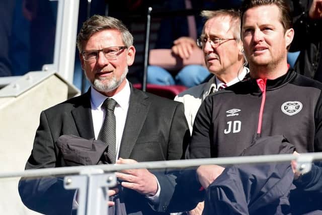 Levein was all smiles ahead of the match as he took his seat in the directors' box. Picture: SNS Group