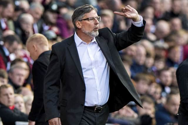 Craig Levein shouts instructions from the touchline after starting the match in the stands. Picture: SNS Group