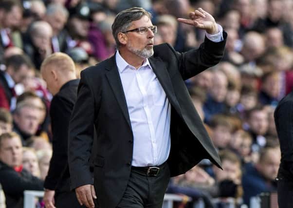 Craig Levein shouts instructions from the touchline after starting the match in the stands. Picture: SNS Group