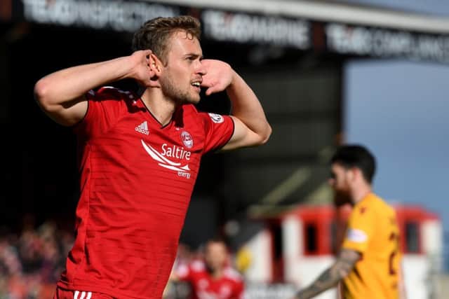 James Wilson wheels away after opening his account for Aberdeen. Picture: SNS Group