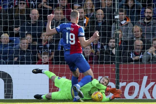 Ross County keeper Scott Fox saves at the feet of Inverness's Jordan White. Picture: Craig Foy/SNS