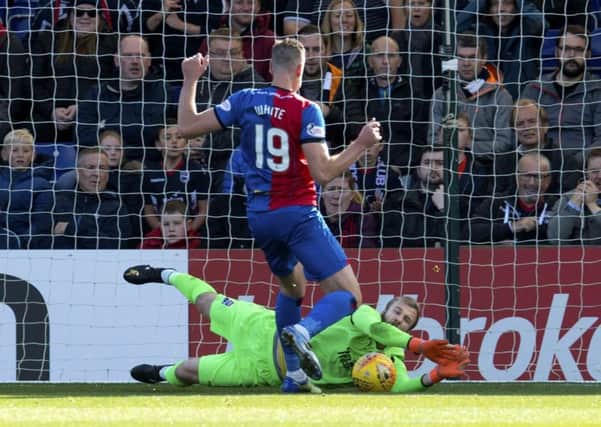 Ross County keeper Scott Fox saves at the feet of Inverness's Jordan White. Picture: Craig Foy/SNS