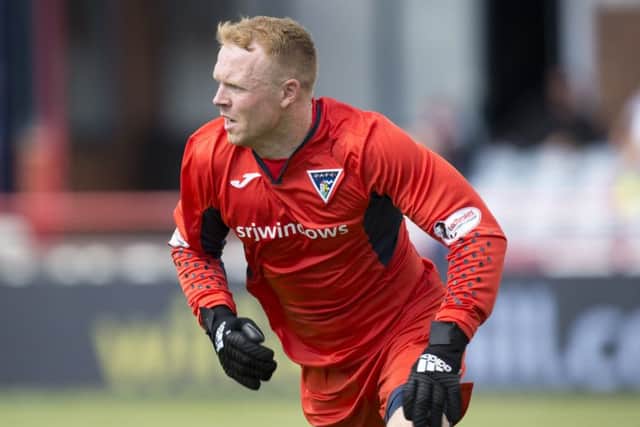 Dunfermline goalkeeper Lee Robinson fumbled a shot from Scott Tiffoney. Picture: Rob Casey/SNS