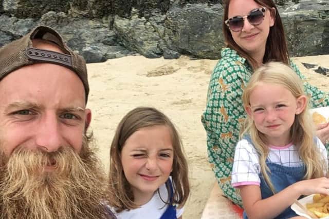 Married couple, Natalie and William Goodacre, of Lincoln, in Lincs., who have decided to sell their home and all their belongings so they can take their children, Bonnie (right) aged seven and Ava, aged eight, to travel around the world. Picture: SWNS
