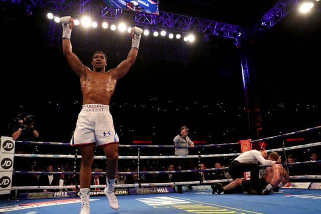 Anthony Joshua celebrates retaining his titles at Wembley. Picture: Getty.