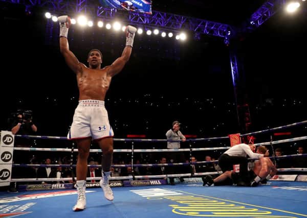 Anthony Joshua celebrates retaining his titles at Wembley. Picture: Getty.