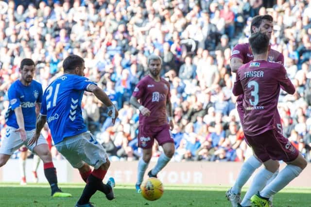Daniel Candeias scores Rangers' fifth goal in their 5-1 victory over St Johnstone. Picture: PA.